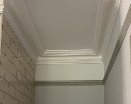 How can wooden picture rails add a decorative element to any home?