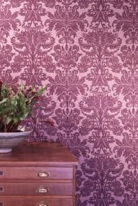 Magenta damask wallpaper in study