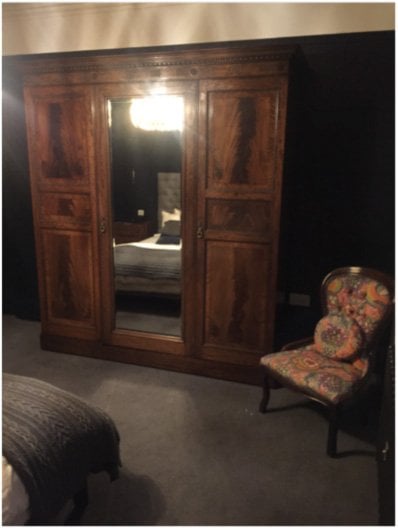 victorian bedroom with wardrobe and chair