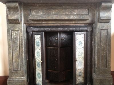 victorian fireplace with doors