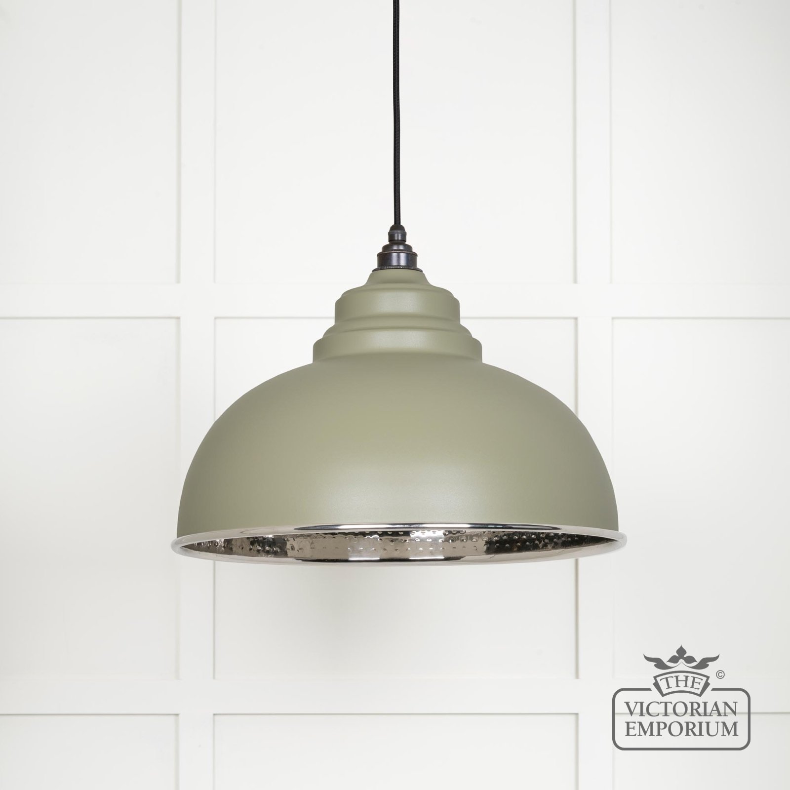Harlow pendant light in hammered nickel with tump exterior
