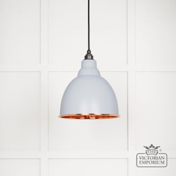 Brindle pendant light in Birch with hammered copper interior.