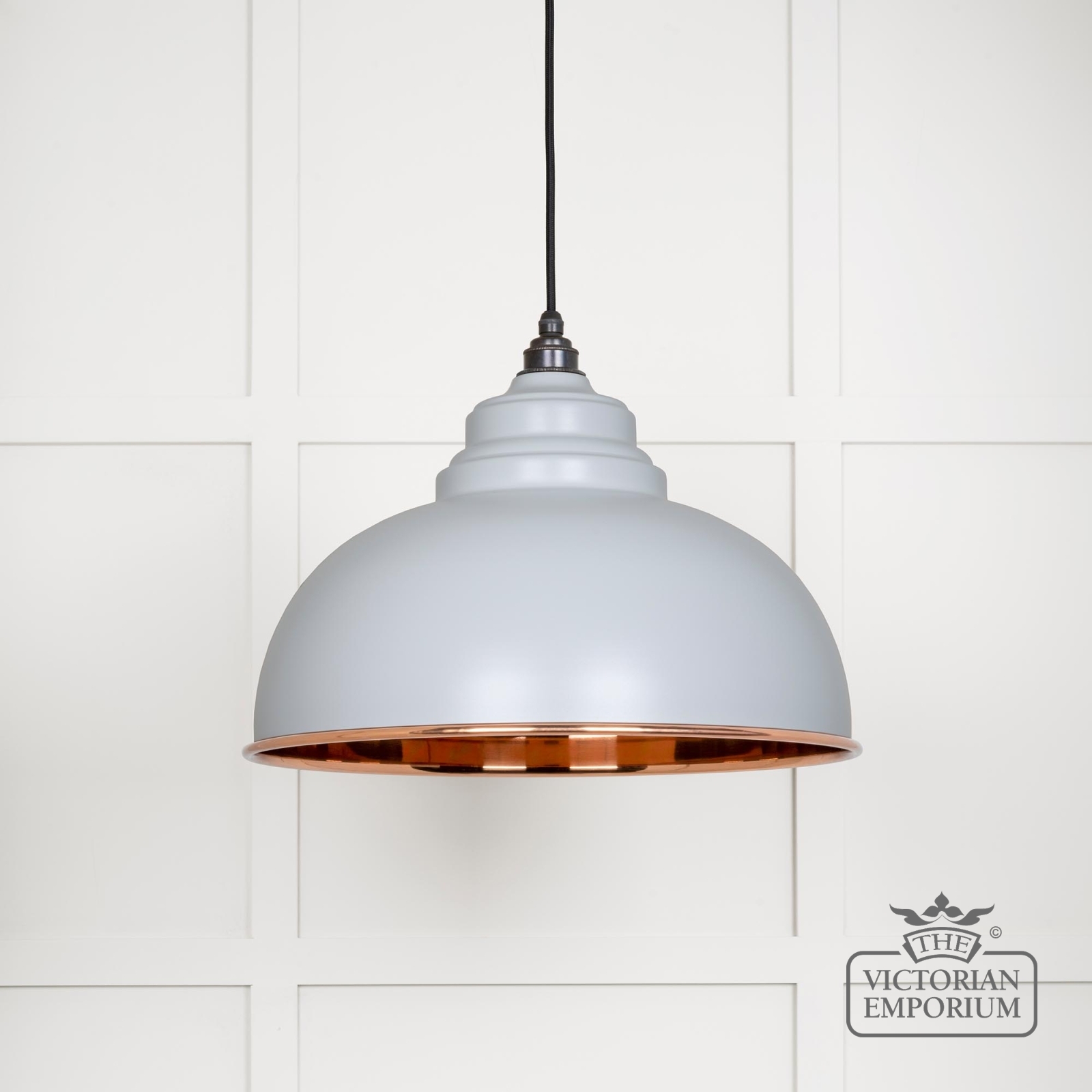 Harlow pendant light in smooth copper with birch exterior