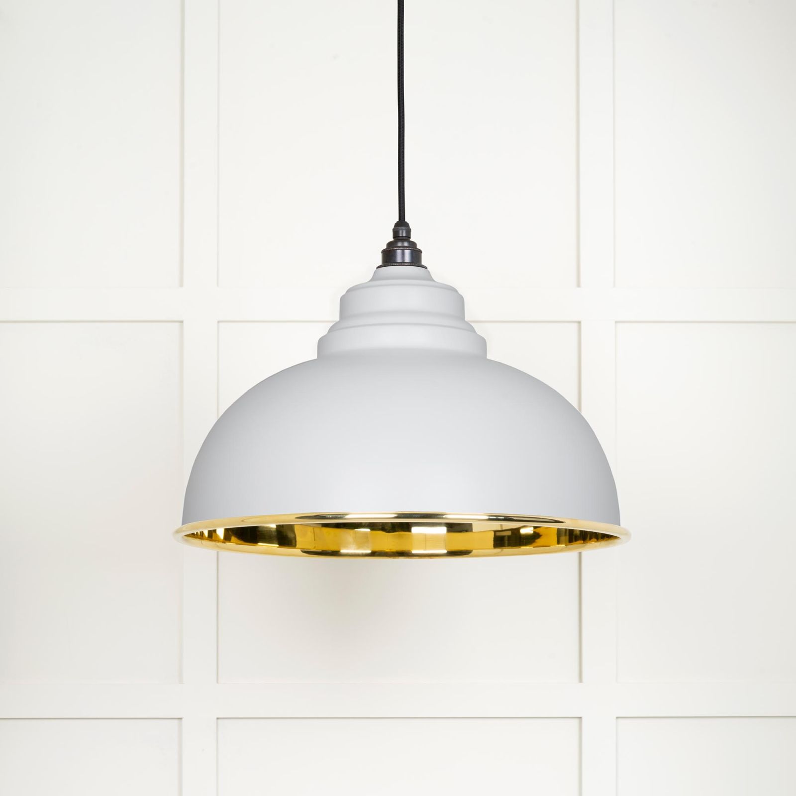 Harlow pendant light in smooth brass with painted Flock exterior