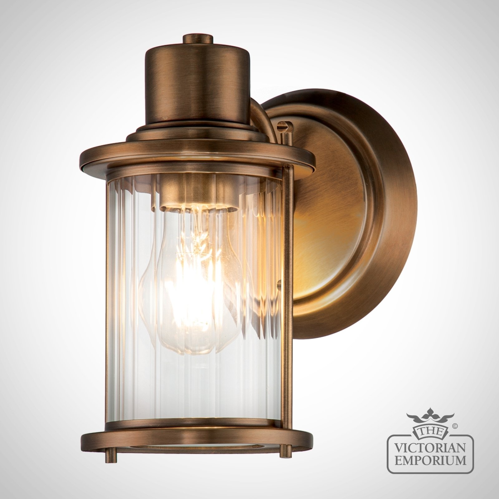 Riggs Single Bathroom Wall Light in Weathered Brass
