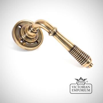 Reeded Lever Handle on Rose in Aged Bronze