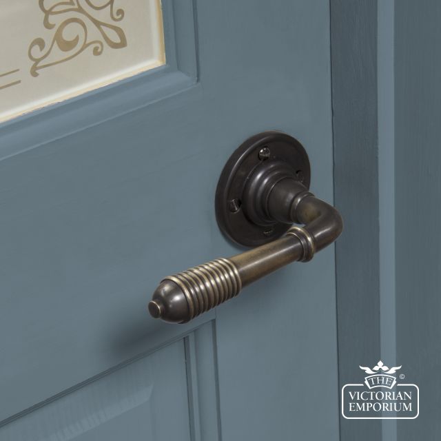 83957 Ireeded Lever Handle On Rose In Aged Bronze