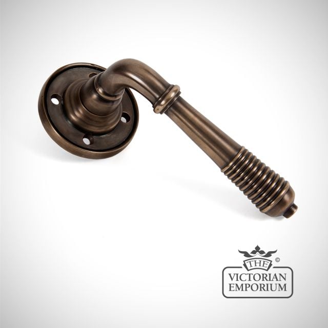 Reeded Lever Handle on Rose in Aged Bronze