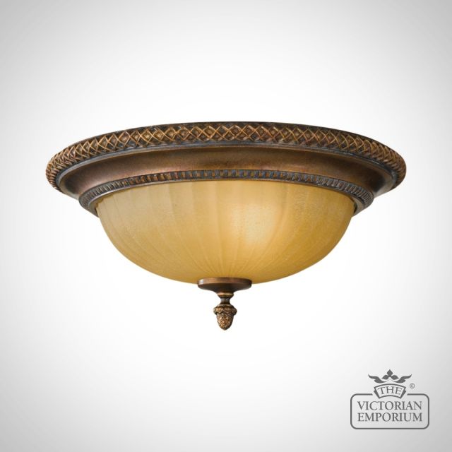 Flush mount light in gold and bronze