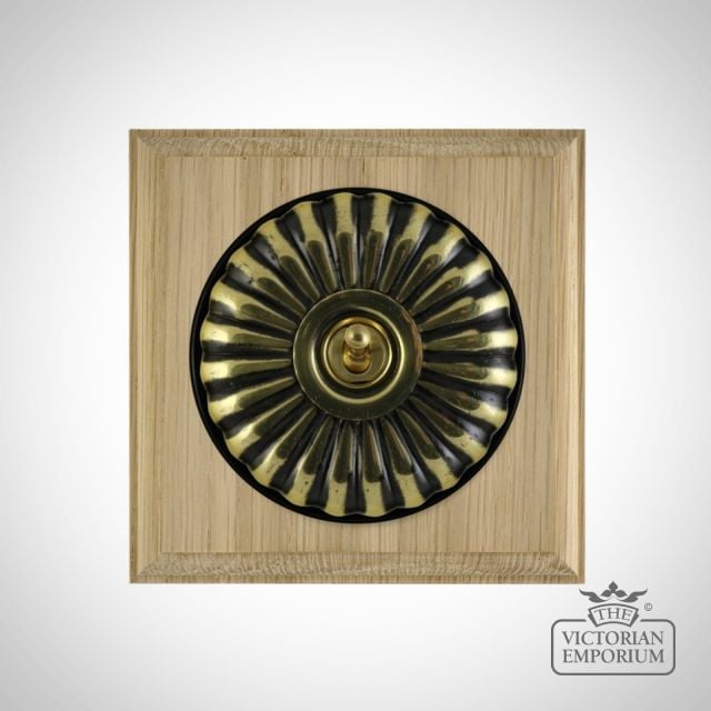 X1gang Single Toggle Period Light Switch Fluteted Antique Brass Black Natural Oak Base