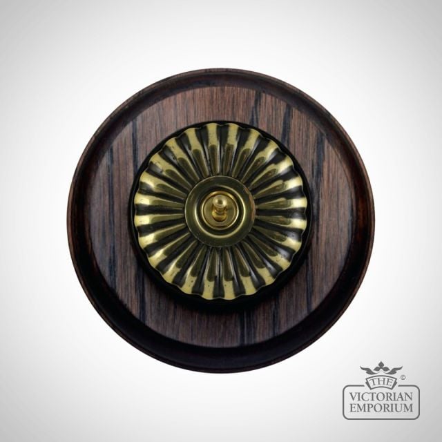 Period Light Switch Fluteted Antique Brass Black Mahogany Circular Base