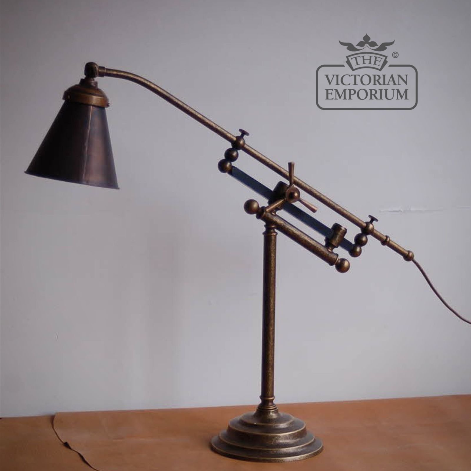 Adjustable brass desk lamp with copper shade