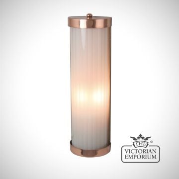 Reeded glass wall sconce in antique bronze