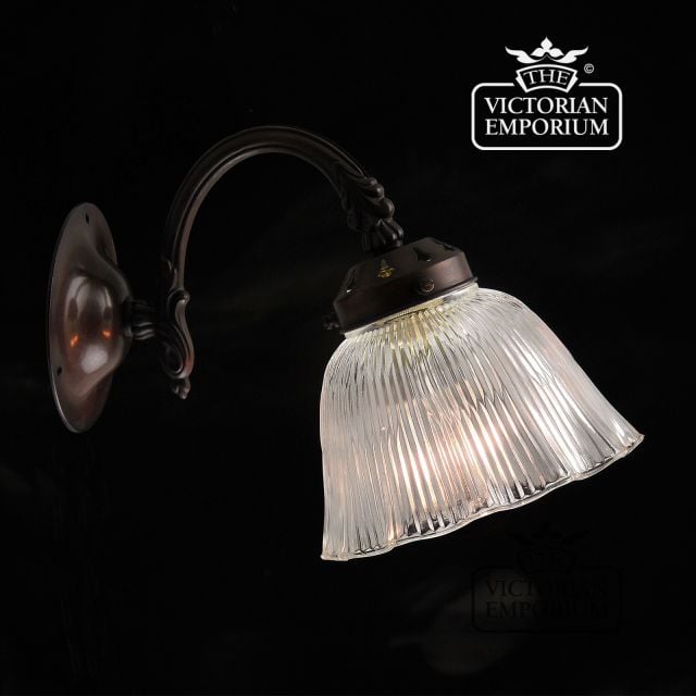 Reeded and fluted glass wall sconce in antique bronze