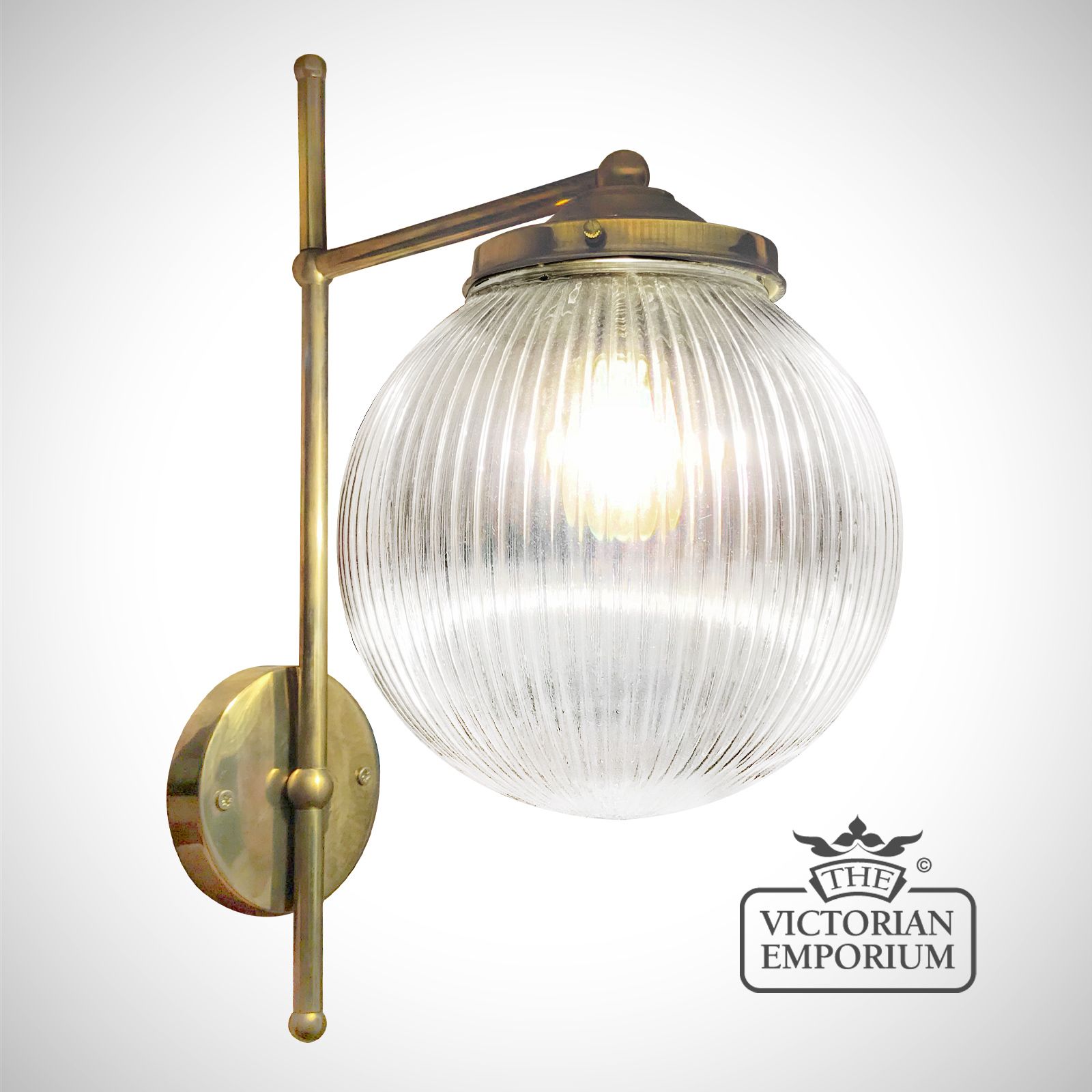 T Bracket Single Globe Wall Light - featuring a prismatic reeded glass shade and a distressed brass finished bracket