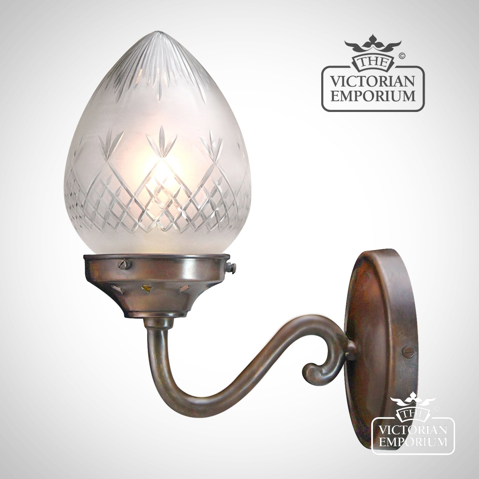 A quintessential Victorian wall light -  featuring hand blown, pineapple etched cut glass shade in a traditional antique bronze finish