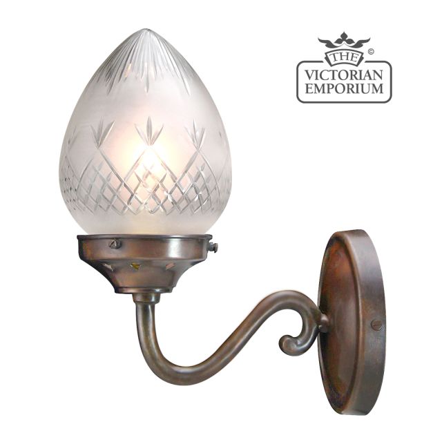 A quintessential Victorian wall light -  featuring hand blown, pineapple etched cut glass shade in a traditional antique bronze finish