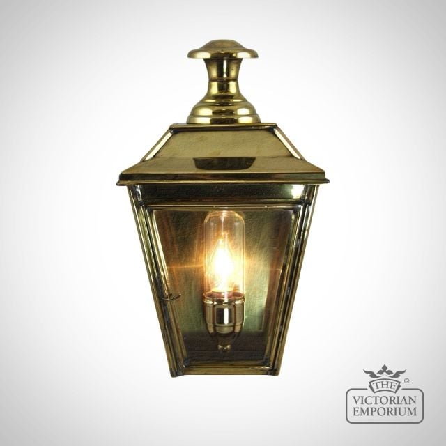 William half wall light in distressed brass