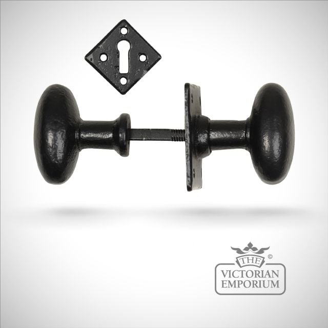 Black iron handcrafted oval door knob on square plate