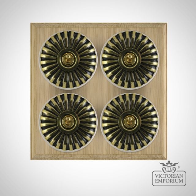 X4gang Quad Toggle Period Light Switch Fluteted Antique Brass White Natural Oak Base