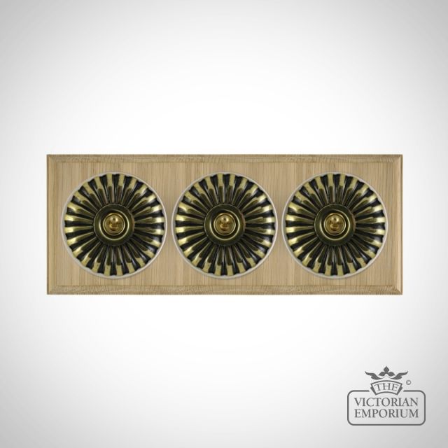 X3gang Tripple Toggle Period Light Switch Fluteted Antique Brass White Natural Oak Base