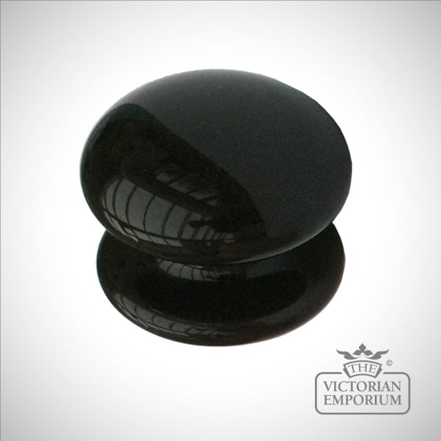 Round black or cream cabinet knob